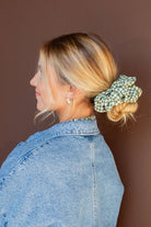 Model styled with the Lindsey Checked Jumbo Scrunchie showcasing the textured checkered fabric and oversized design gentle on hair.