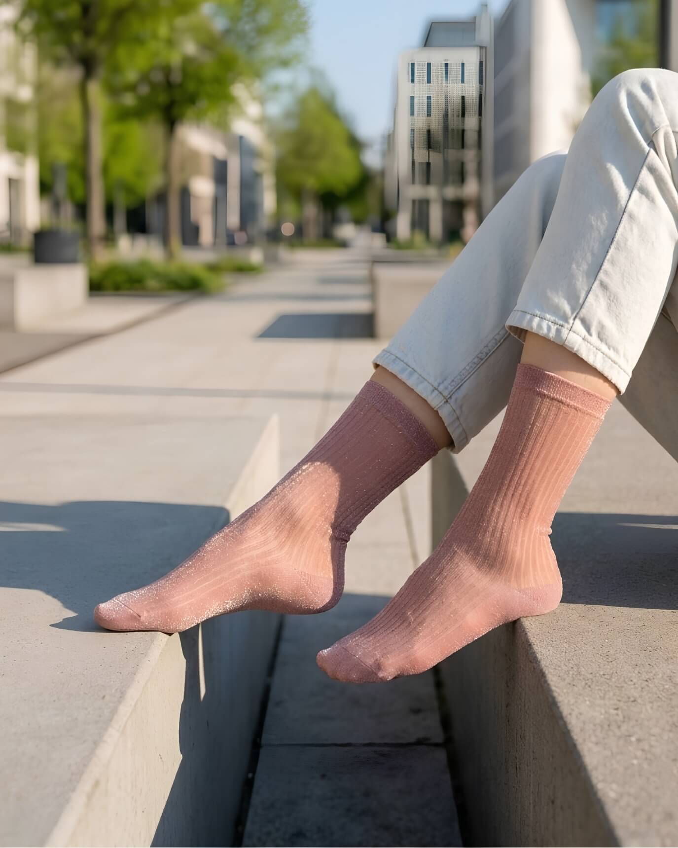 Sheer Metallic Ribbed Crew Socks in dusty pink with metallic sparkle, styled with light denim on an outdoor bench, emphasizing the breathable sheer texture and subtle ribbed pattern.
