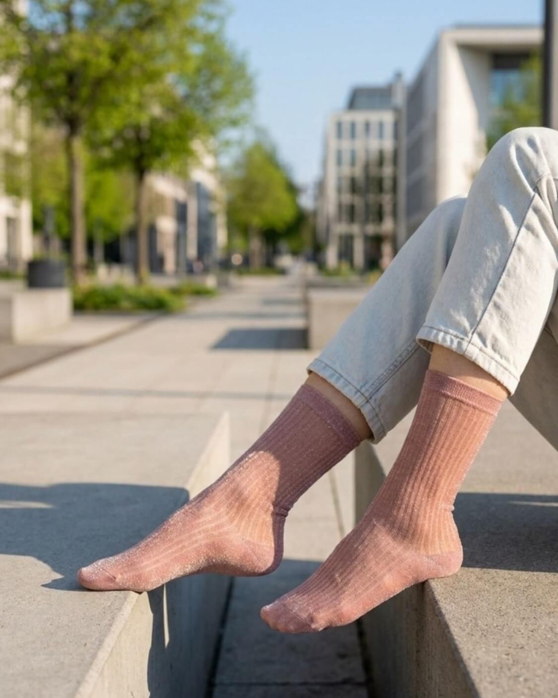 Sheer Metallic Ribbed Crew Socks in dusty pink with metallic sparkle, styled with light denim on an outdoor bench, emphasizing the breathable sheer texture and subtle ribbed pattern.