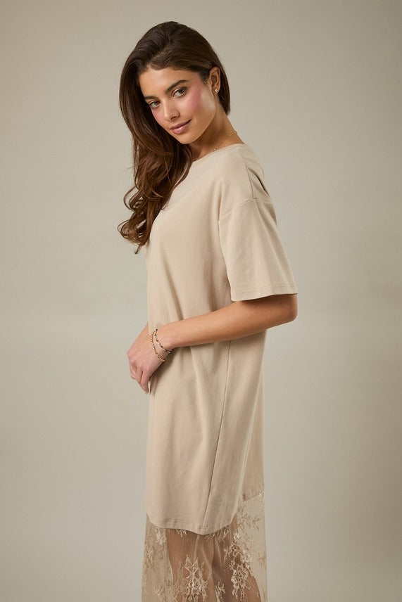 Side view of model in the taupe Round Neck Lace Joined T-Shirt Maxi Dress showing the relaxed t-shirt fit and elegant lace-joined maxi length.