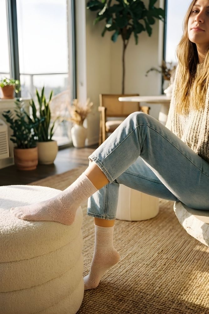 Lace Pattern Sheer Sock featuring sheer white lace pattern socks worn in a bright indoor setting with relaxed posture, highlighting soft texture, breathable knit, and ankle-length fit.