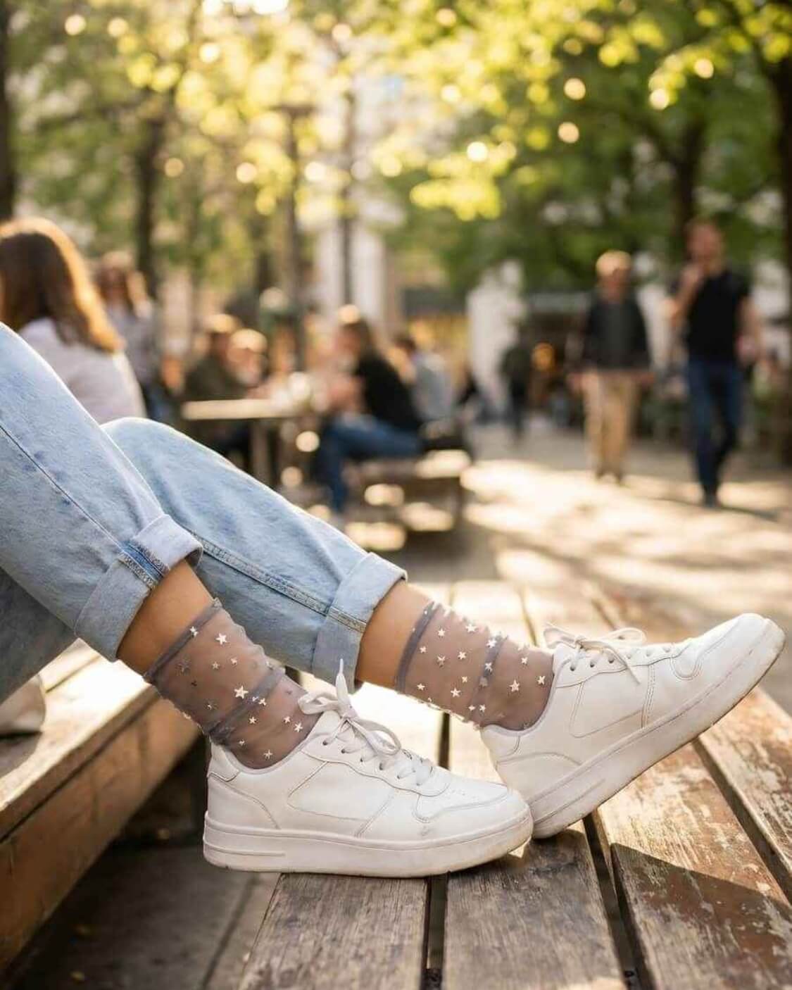 Star Soft Tulle Mesh Sheer Socks featuring transparent tulle mesh with shimmering star detailing and a soft ankle-length fit, styled with white sneakers and rolled jeans on a wooden bench outdoors, showcasing a playful casual aesthetic with lightweight comfort.