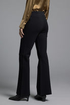 Model showcasing black Kick Flare Pants Sasha Pants designed with a fitted hip line, slight flare at the hem, and vintage-inspired silhouette.
