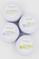 Love Classic collection of crushed crystal candles in Rose Quartz, Jade, Amethyst, and Citrine tins