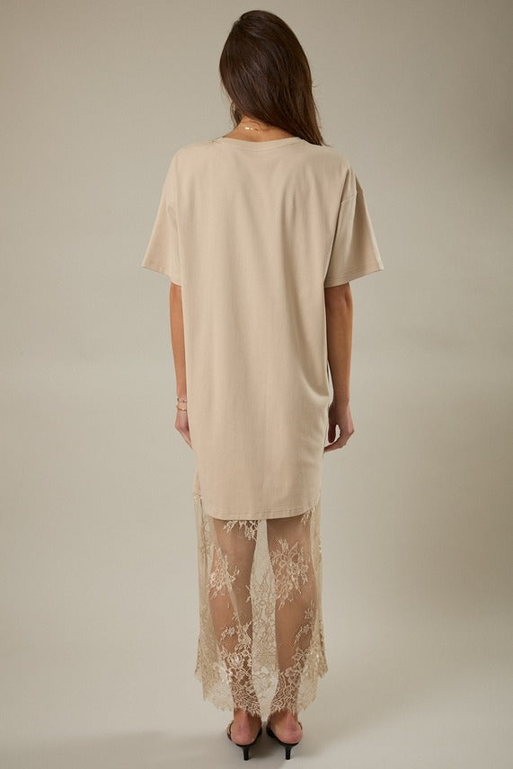 Back view of model wearing the taupe Round Neck Lace Joined T-Shirt Maxi Dress highlighting the flowing maxi skirt and lace panel detailing.