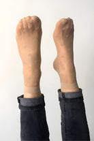 2-Pack Sheer Polka Dot Socks featuring a sheer nude knit with delicate dotted accents and smooth elastic cuff, shown with both feet raised, highlighting lightweight feel, subtle texture, and effortless styling appeal.