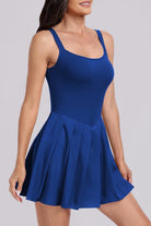 Woman wearing a pleated blue dress 
