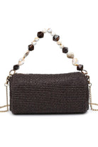 Chocolate Rachel Straw Clutch with compact zip-top closure, detachable chain strap, textured woven exterior, and faceted bead accents.