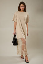 Model styled in the taupe Round Neck Lace Joined T-Shirt Maxi Dress with round neckline, mixed-material design, and elegant maxi silhouette.