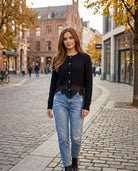 The Eloise Cardigan in black styled with light-wash jeans