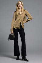 Model standing in black Kick Flare Pants Sasha Pants emphasizing the flattering cut, structured design, and elongating kick flare shape.