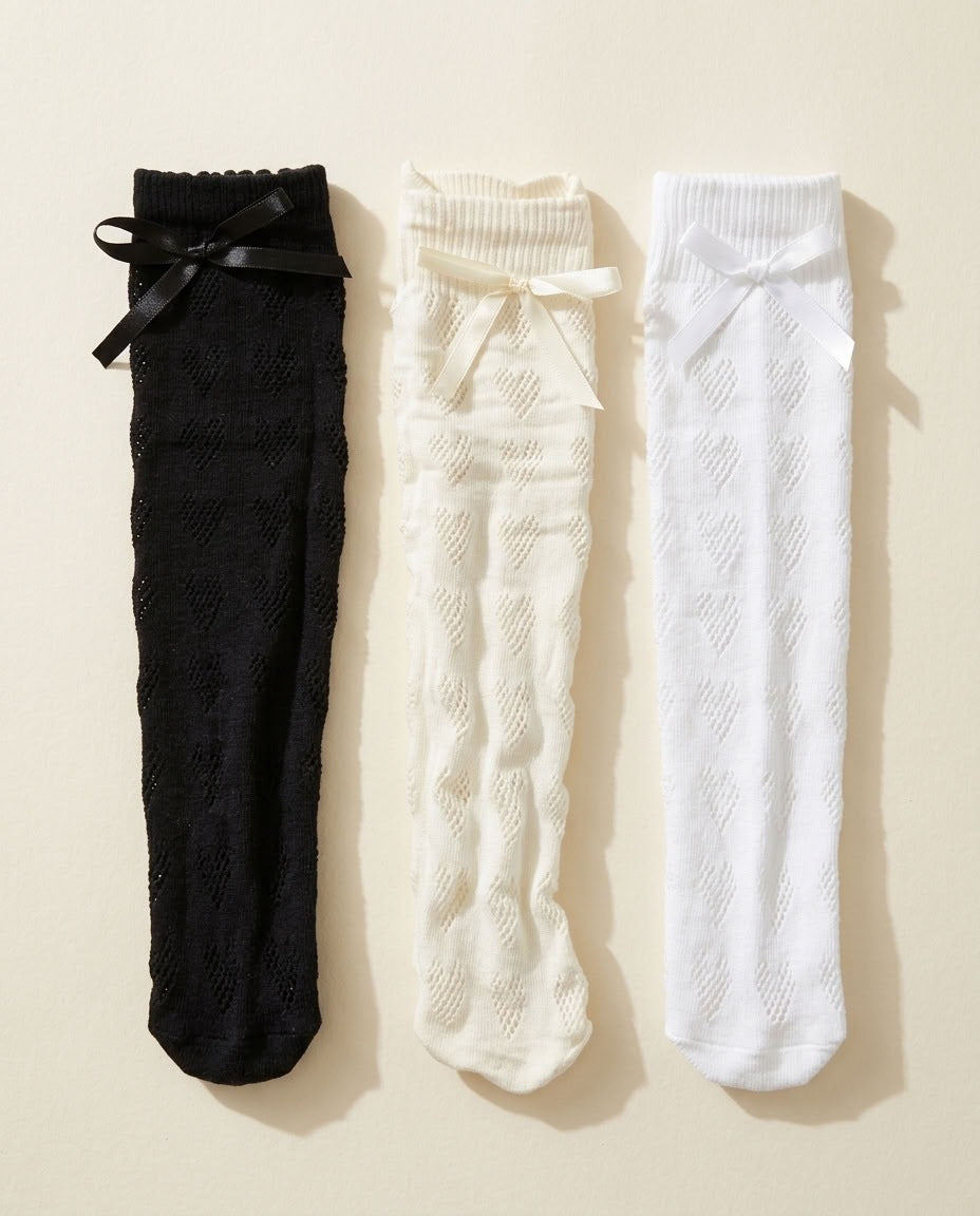 3-Pack Heart-Shaped Lace Bow Socks flat lay in Black, Milk White and White with satin bows