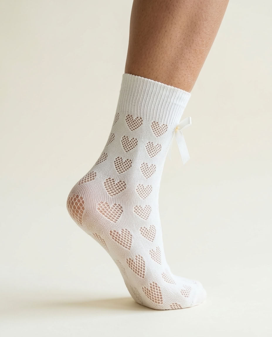 Pure White Heart-Shaped Lace Bow Sock, side view on tiptoe with white satin bow