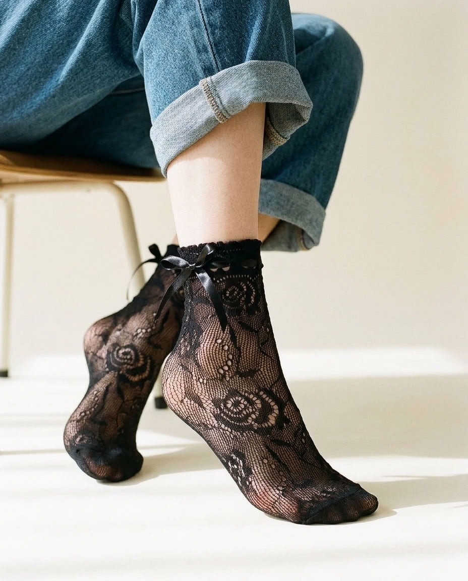 Close-up of Ribbon Tie Rose Lace Socks in Black with bow at the ankle