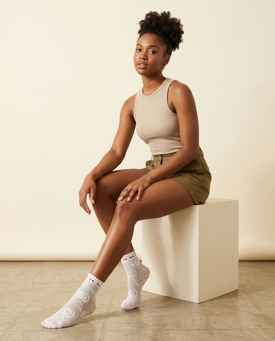Ribbon Tie Rose Lace Socks in Milky White, styled seated